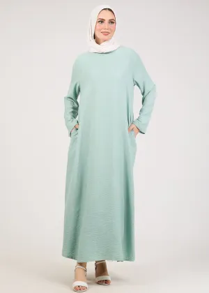 Light Green Kira loose slip dress with pockets in maxi length and with long sleeve