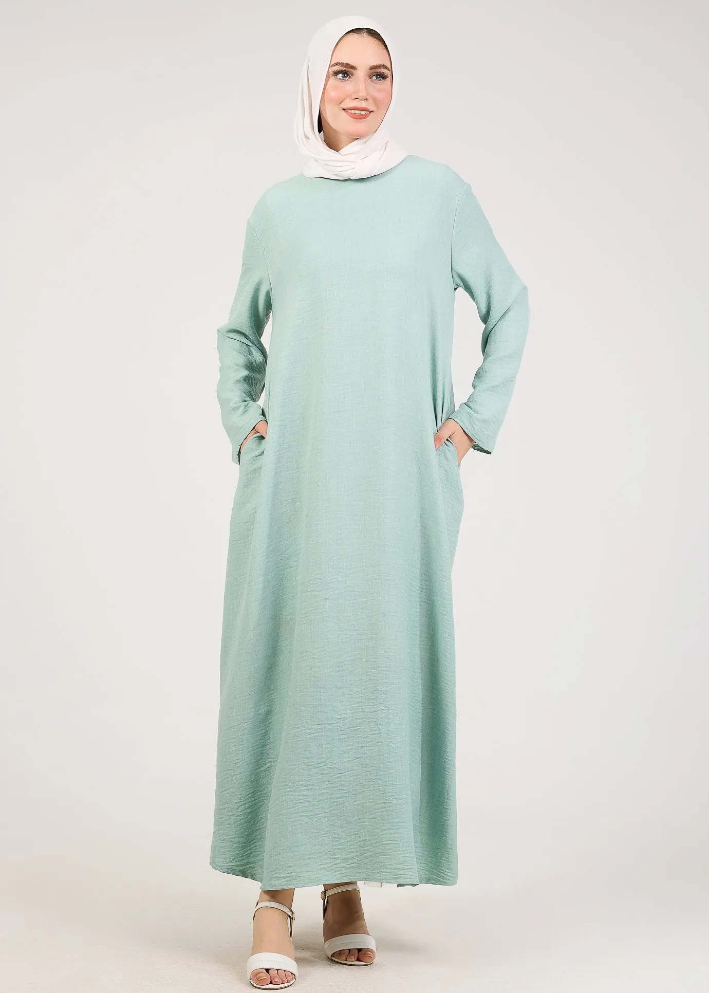 Light Green Kira loose slip dress with pockets in maxi length and with long sleeve