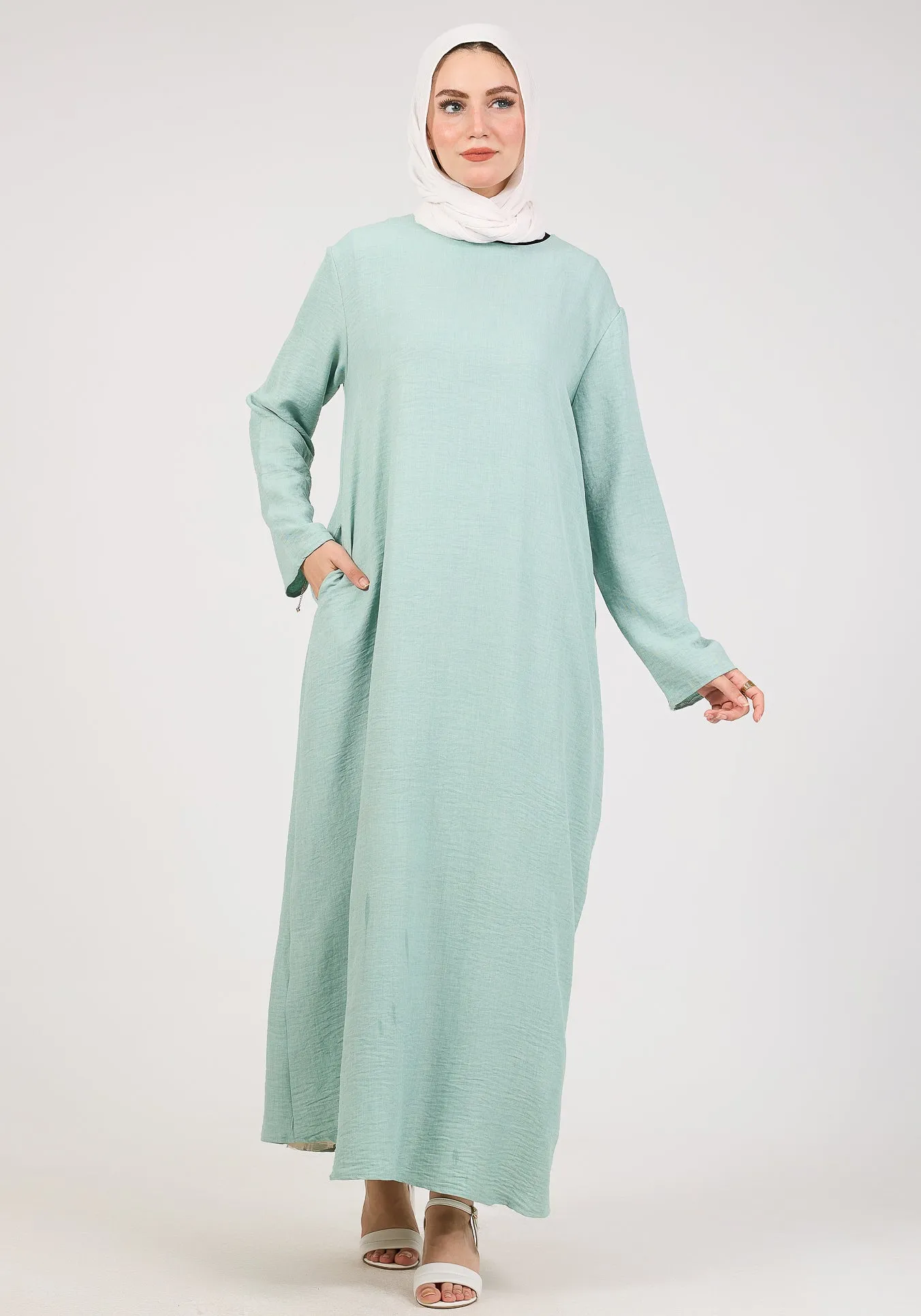 Light Green Kira loose slip dress with pockets in maxi length and with long sleeve