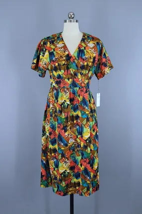 Vintage 1970s Wrap Dress / Orange Abstract Print